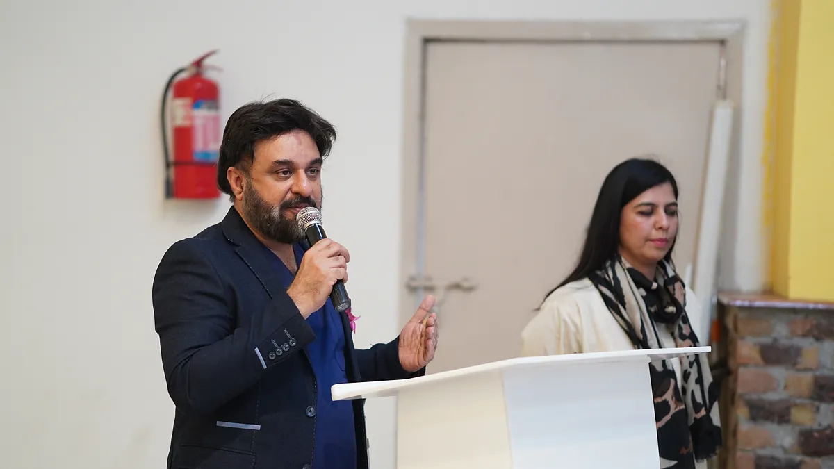 Dr Mohammad Muneeb Khan speaking about cancer prevention at a school assembly.
