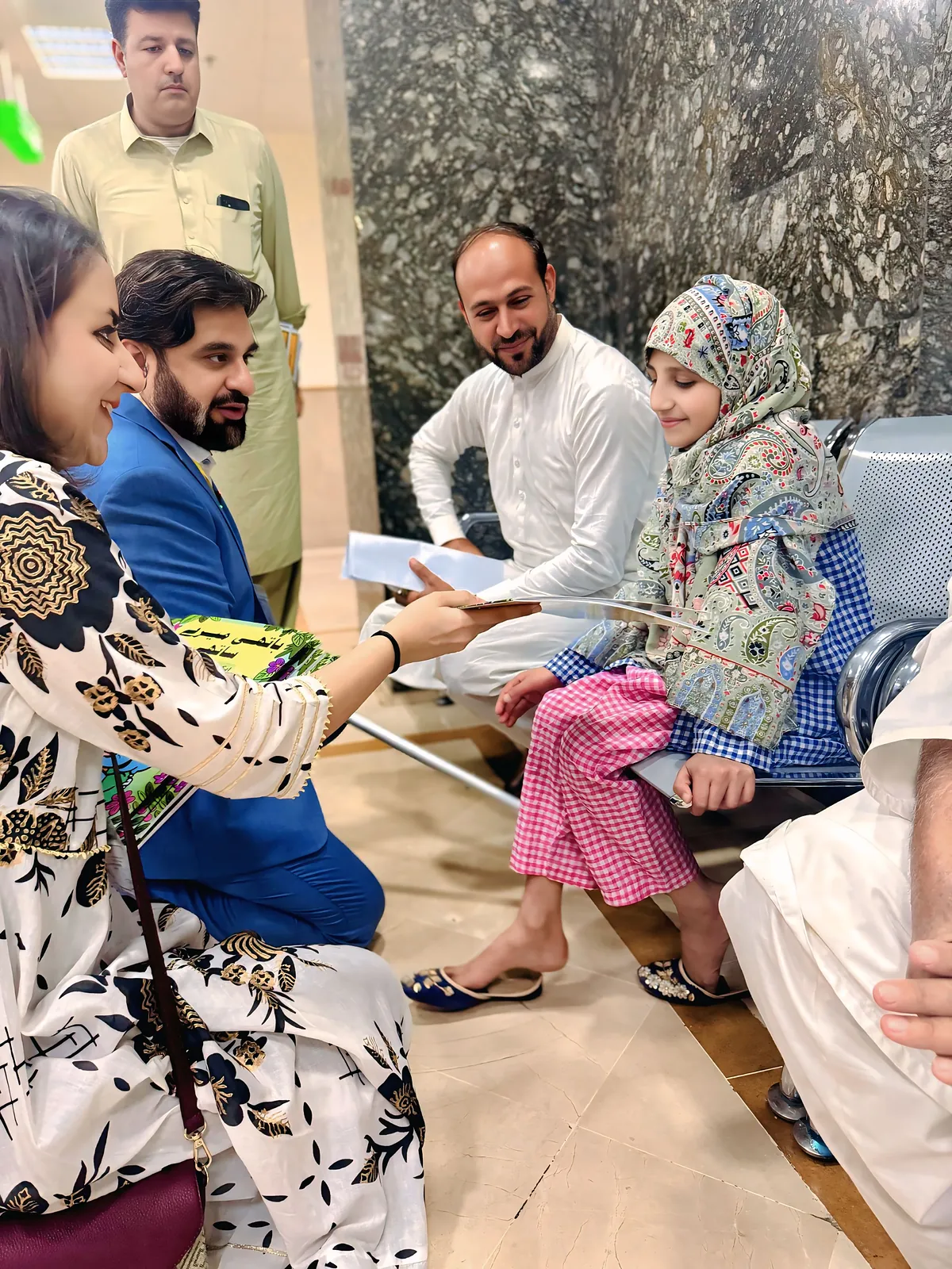Dr Khan and the team in conversation with families during the hospital visit.